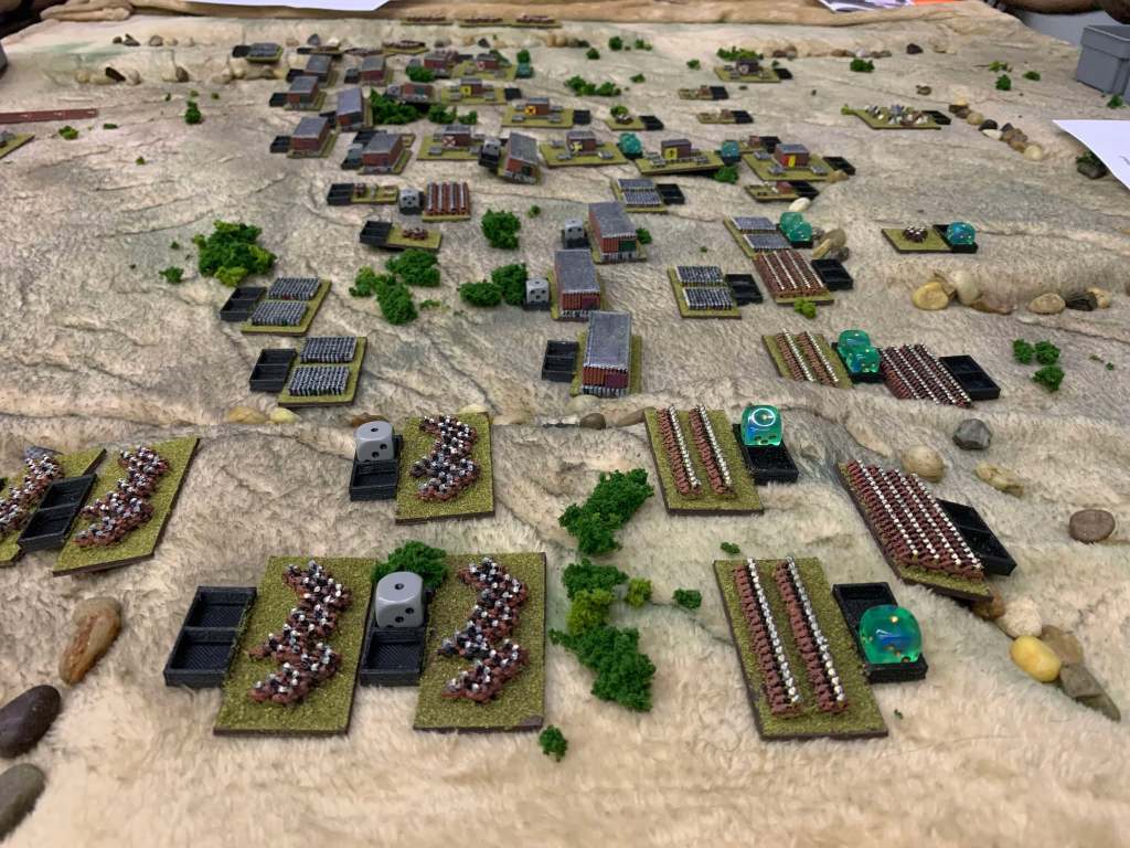 A tabletop battle of 2mm Pike and Shotte units battling across a desert.